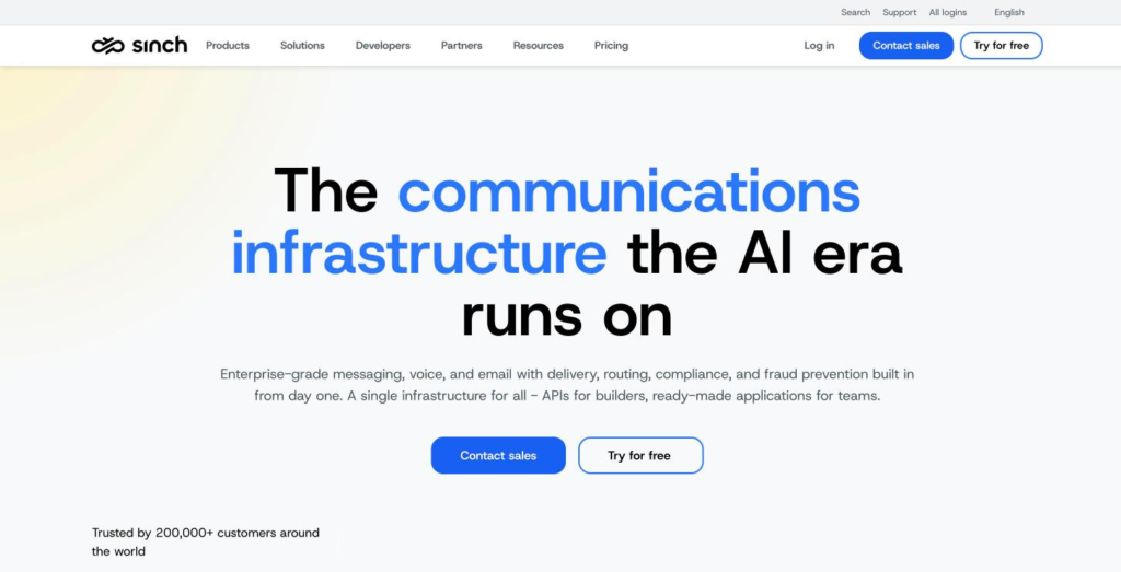 Sinch home page describing itself as the communications infrastructure the AI era runs on, with the channel blocks below.